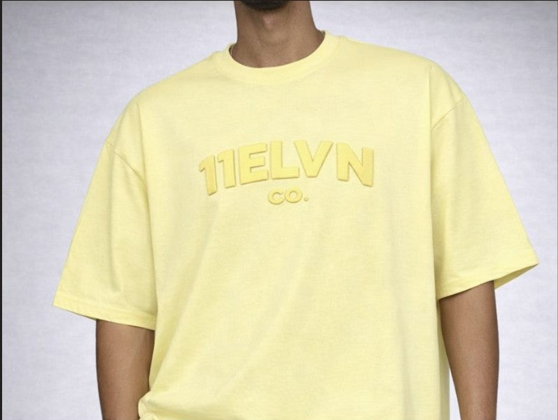 11ELVN CO. CORE LABEL TEE — BUTTER LEMON